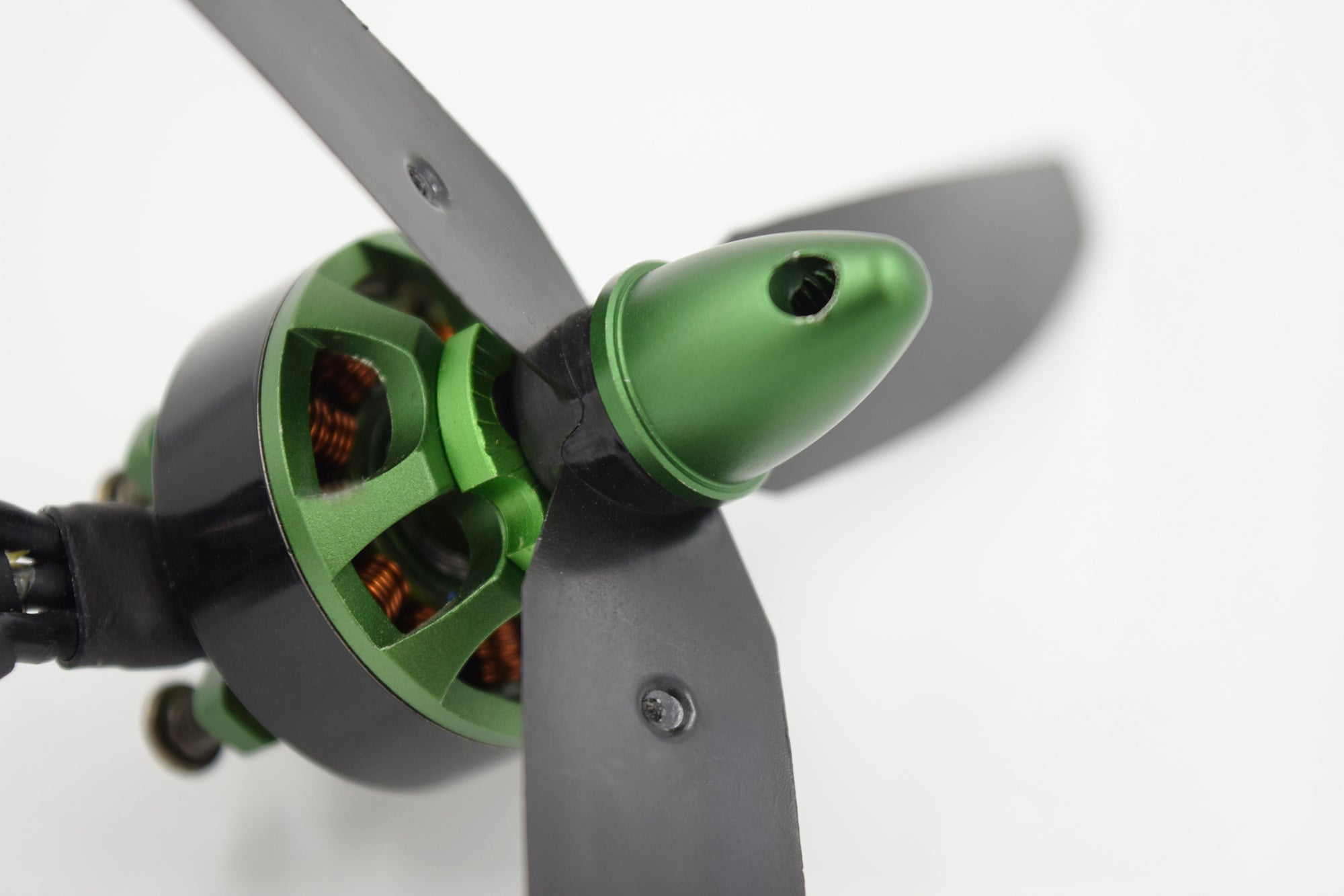 Tri-blade propeller on green brushless motor