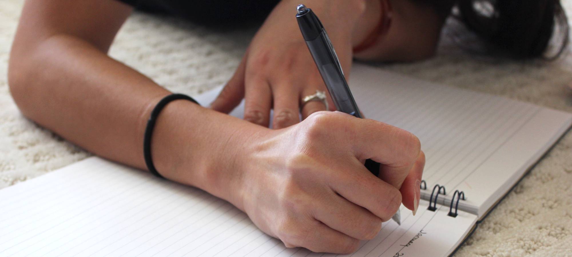 woman writing in journal