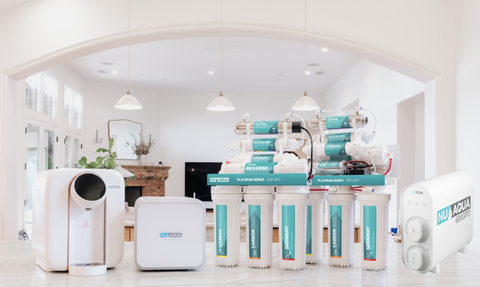 five NU Aqua Reverse Osmosis Systems sitting on a kitchen countertop