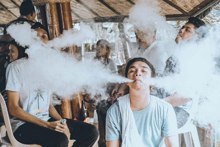 Group of people smoking vape pens