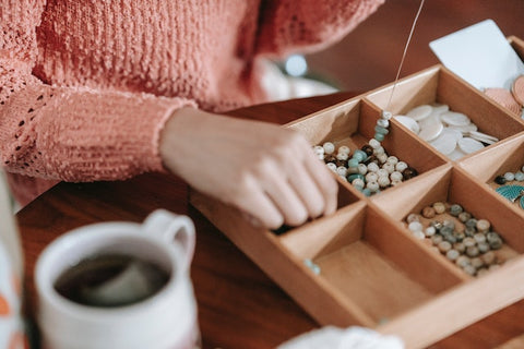 A woman making handmade accessories.