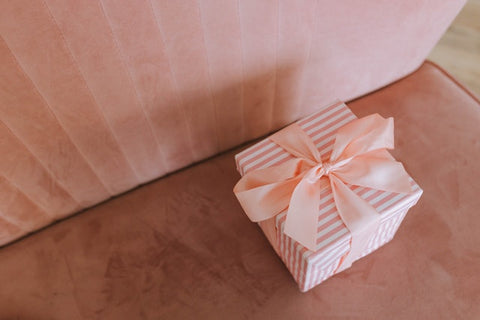 A white and pink gift box.