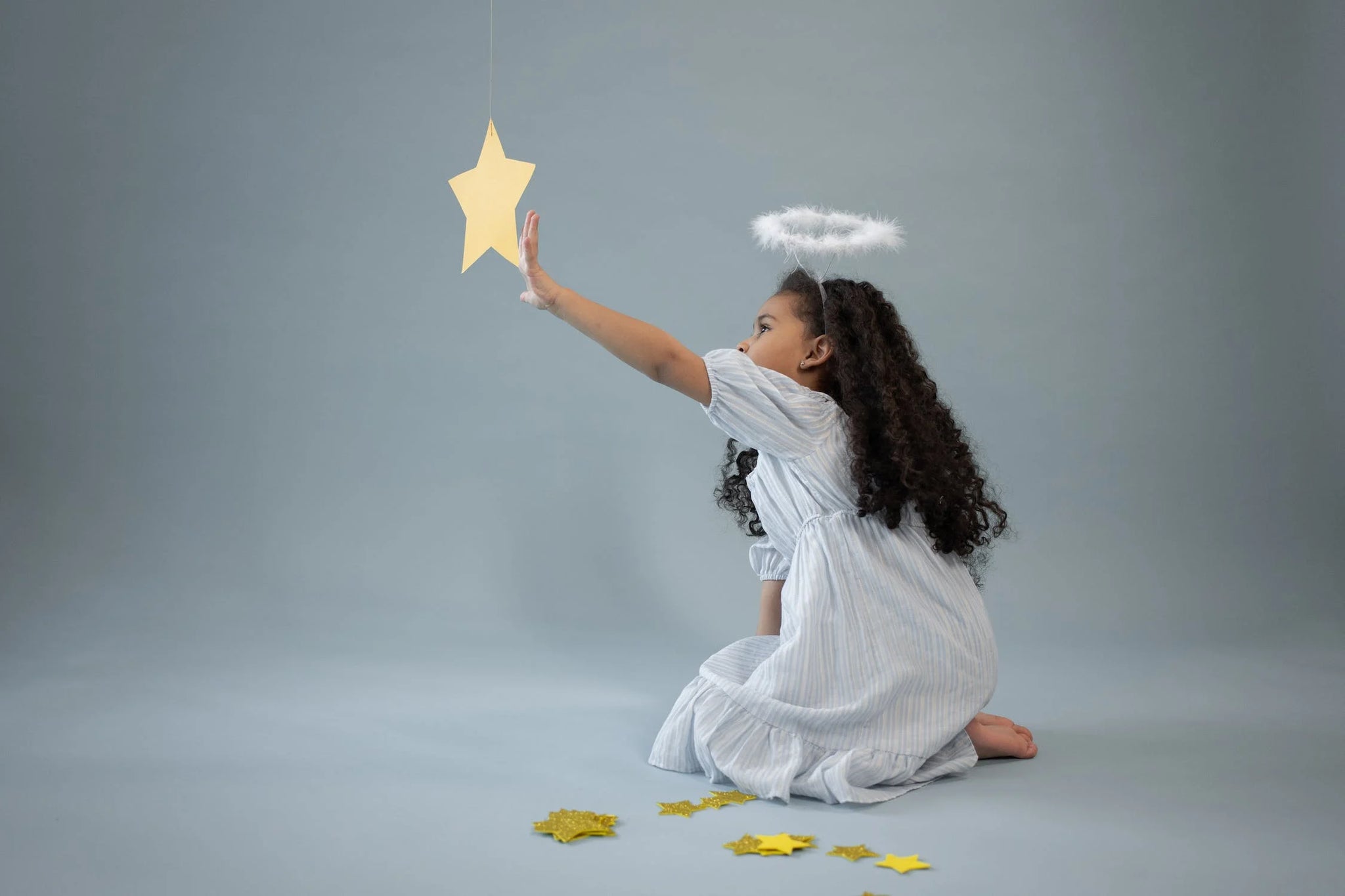 A girl in an angel costume.