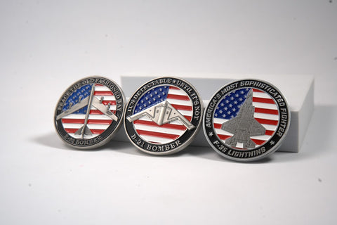 Coin grouping of three different aircraft challenge coins