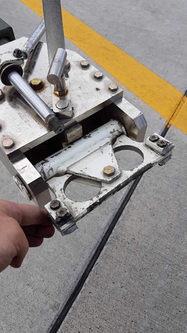 Broken C-130 aircraft tow fitting from shear pin problem