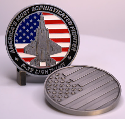 USMC F-35 aircraft Challenge coin showing a US flag and and F-35 Aircraft