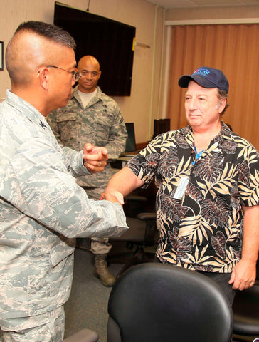 Civilian thanking a military member for their service