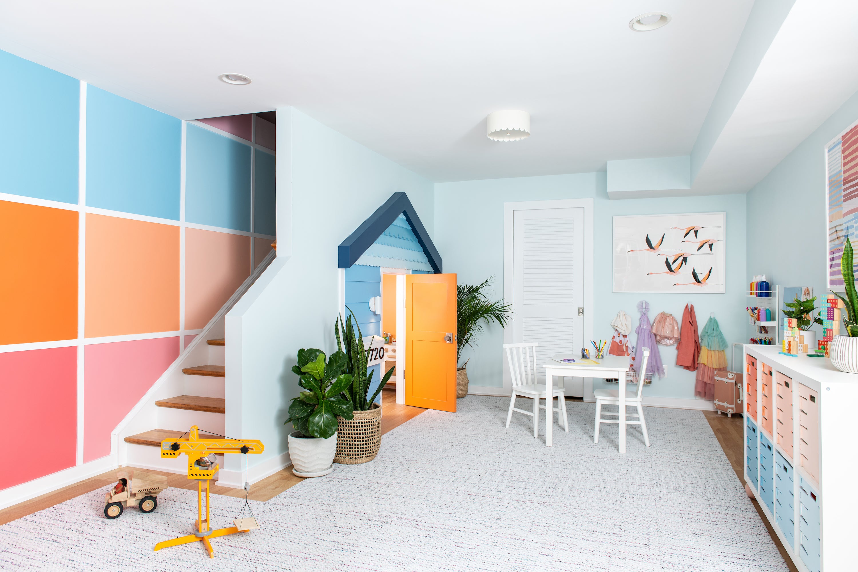 A colorful playroom with a large open space on the floor, ready for play!