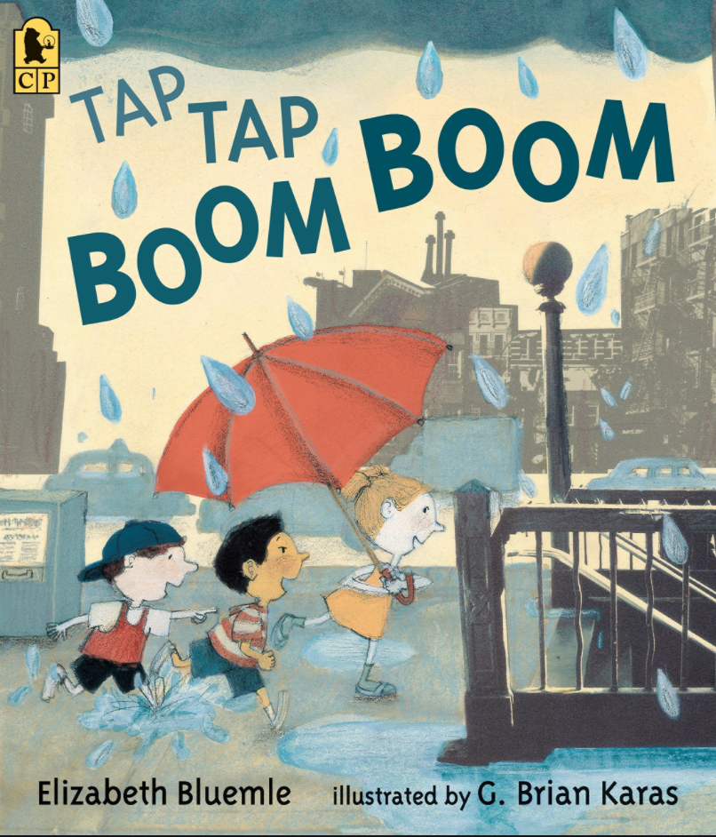 Cover of book "Tap Tap Boom Boom," with three children running in rain, one holding an umbrella, towards a subway stop stairwell