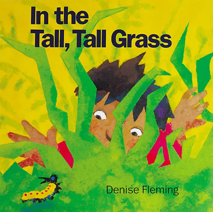 Cover of "In the Tall, Tall Grass," a young child peeking through grass at a caterpillar