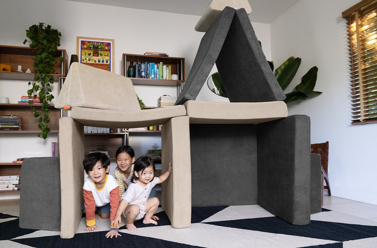 Three children play under a Nugget for made of two Nugget  in Dunebuggy and Harbor