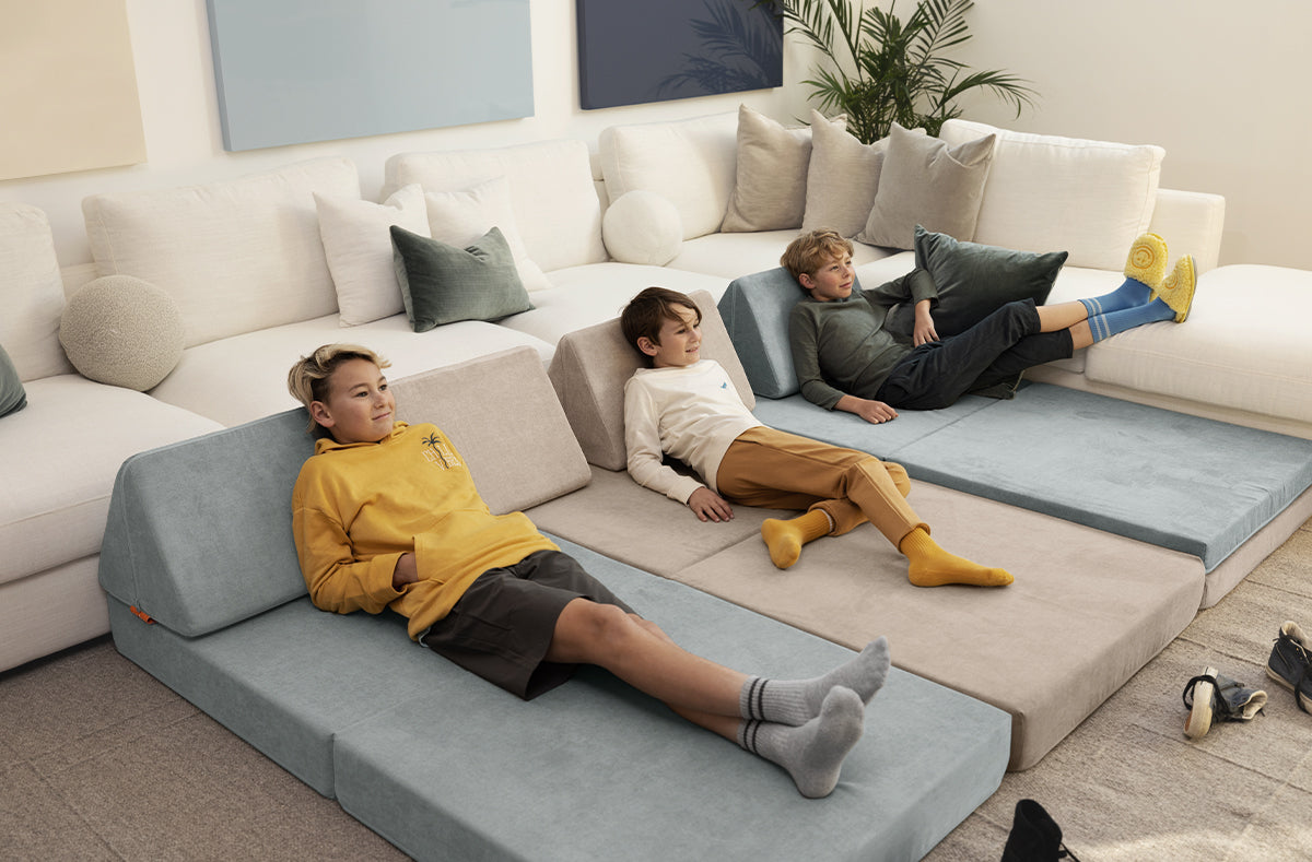 Three children relax on alternating Surfside and Dunebuggy Nuggets