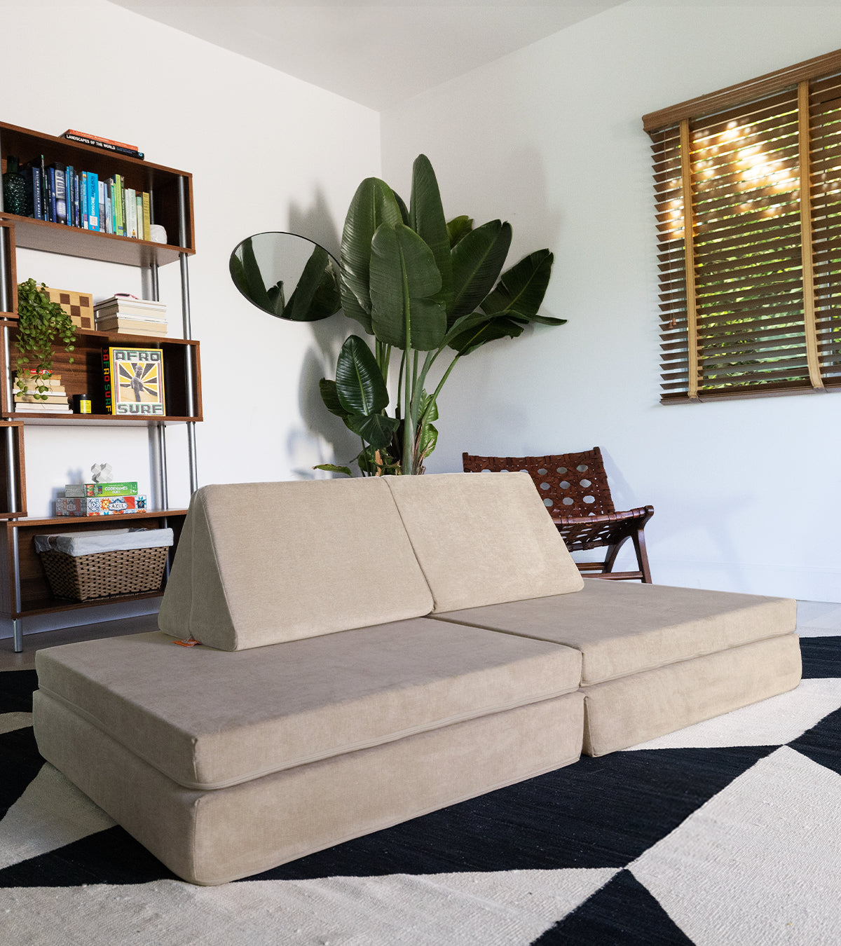 A Dunebuggy Nugget in couch configuration on a black and white rug