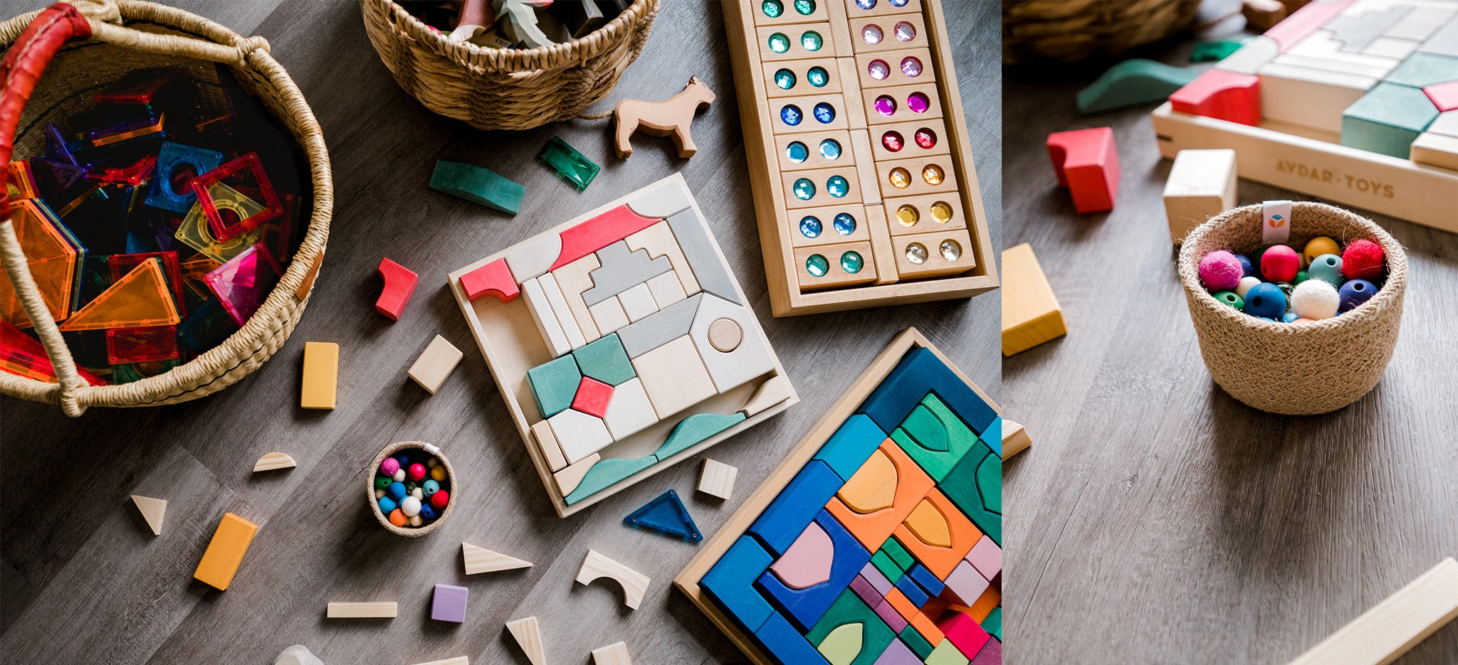 Assorted wood toys, marbles, and pom poms for the ball run