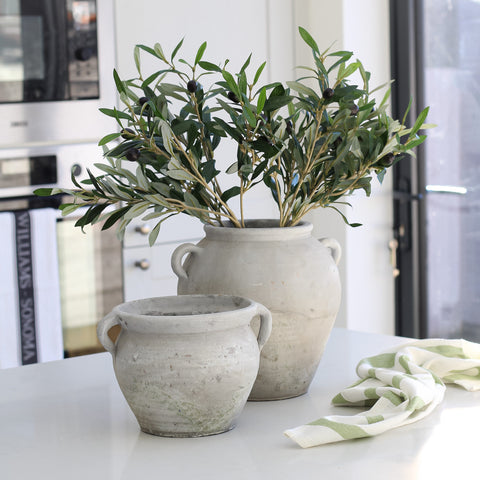 Pair of olive pots with little handles, large pot is filled with faux olive stems