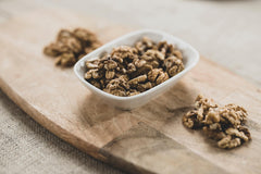 Bowl of walnuts on wooden board - Engin Akyurt