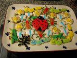 Bug cookies featuring lady bugs, grasshoppers, dragin flies, spiders, caterpillars and bees