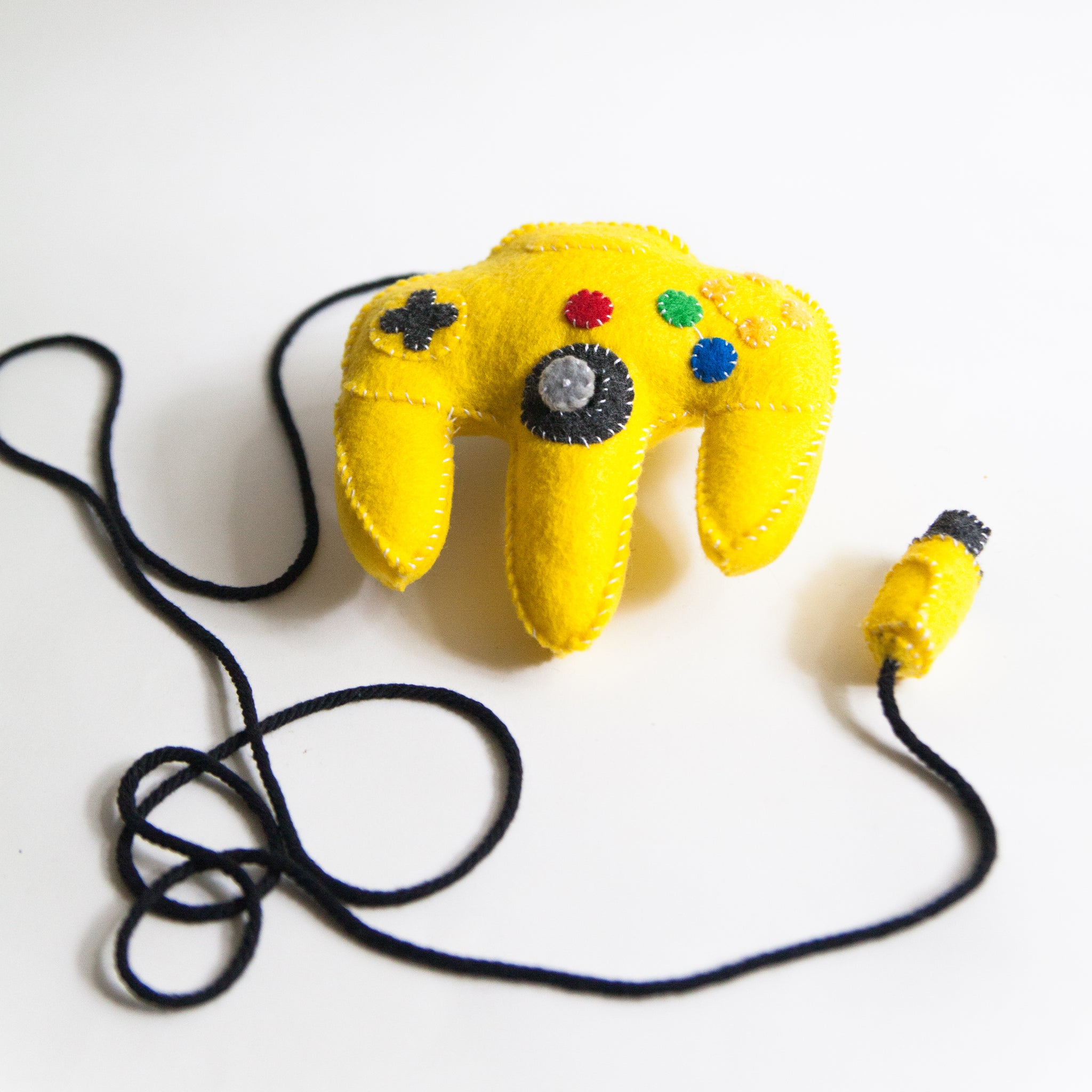 yellow nintendo 64 controller