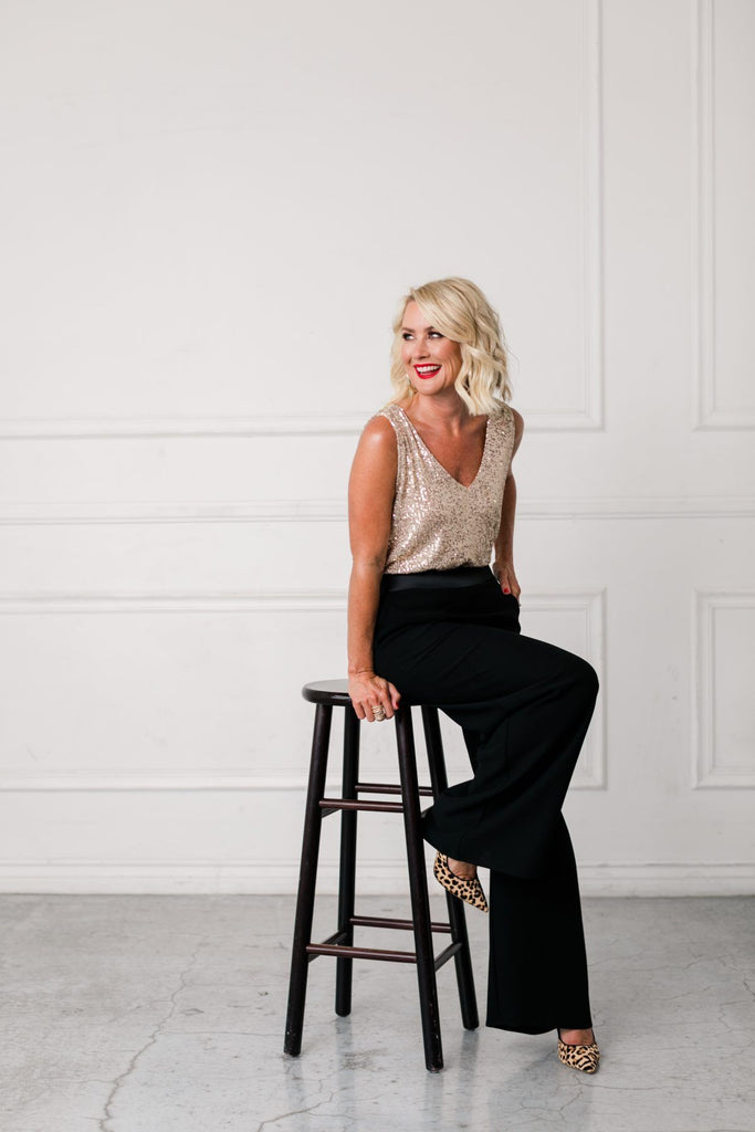 Beautiful woman wearing a Confetti V-Neck Tank paired with the Brigitte Wide Leg Pant and the Leopard Heels.