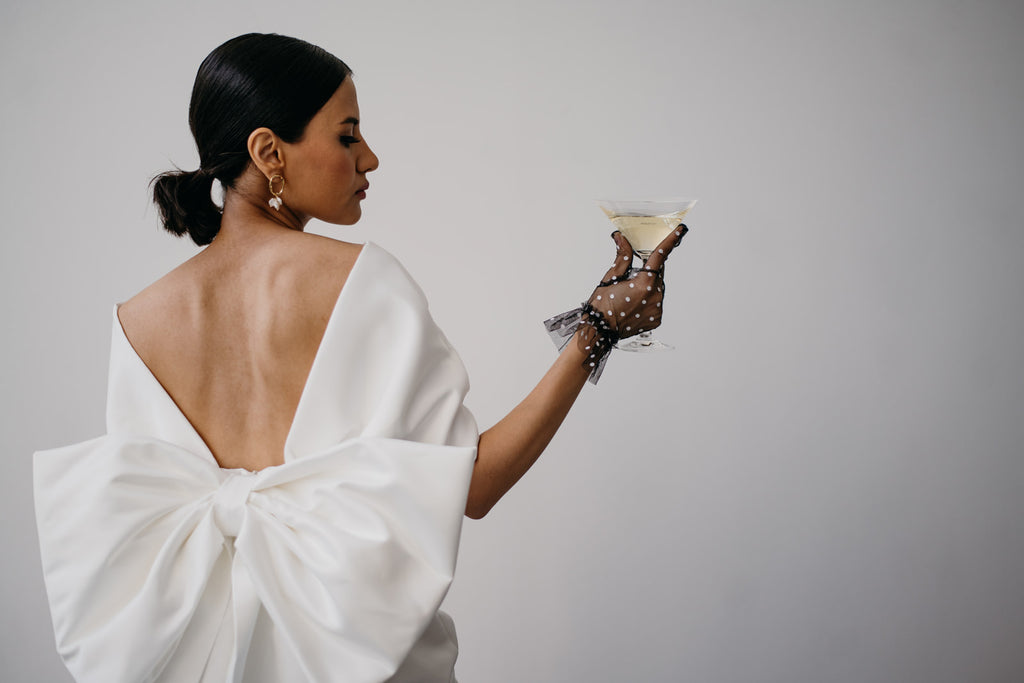 Zoe Rowyn off-the-shoulder modern bridal gown with oversized bow