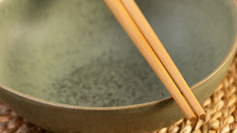  bamboo chopsticks on a bowl