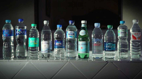 different types of plastic bottles lined up on a counter
