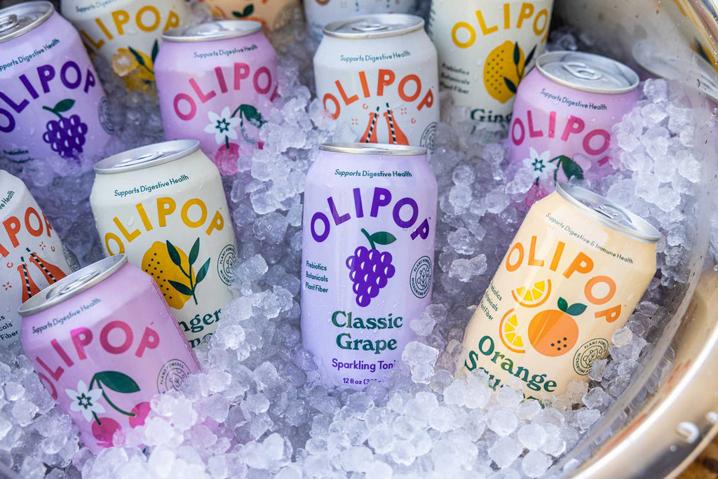 A variety of OLIPOP sodas in a Galvanized Party Tub full of ice