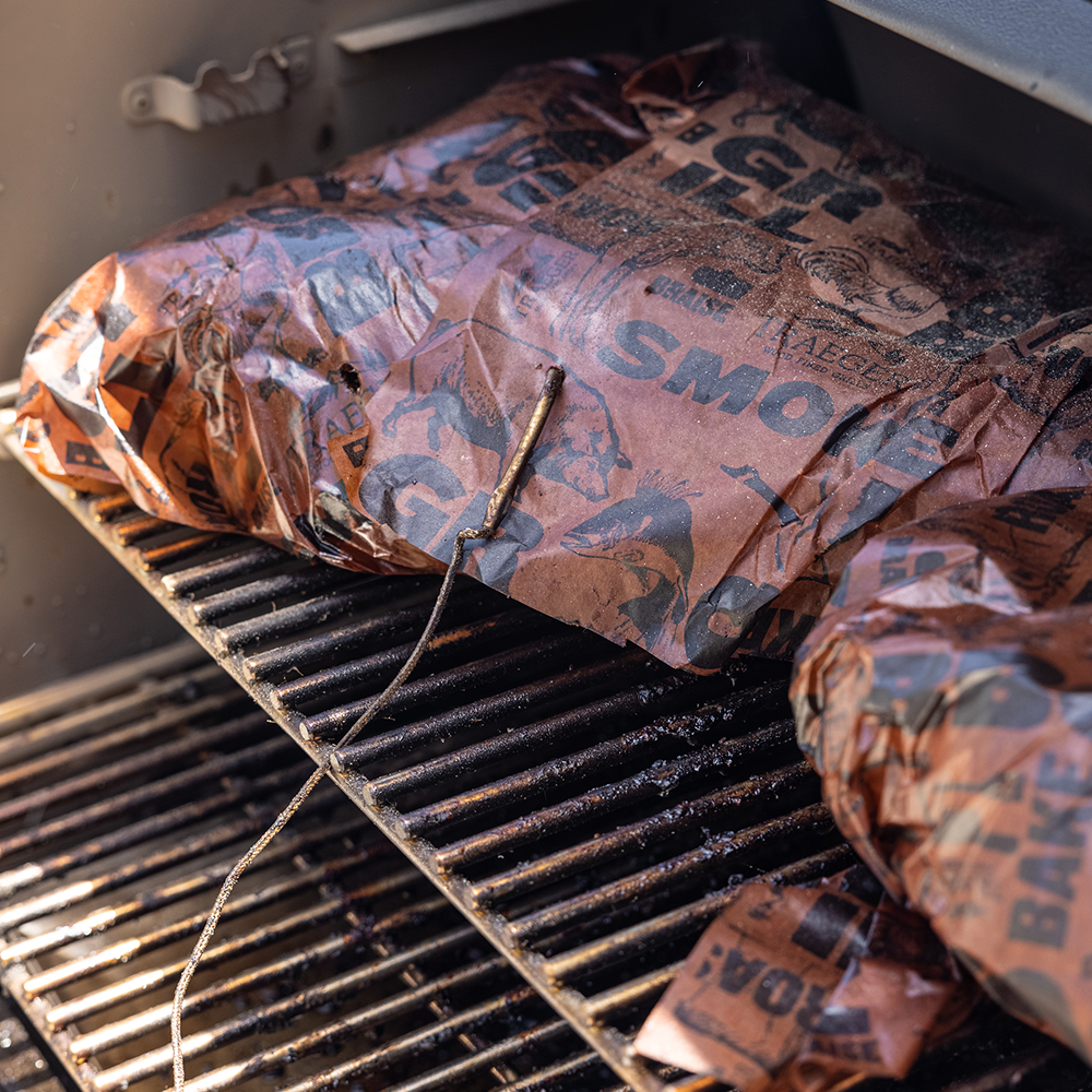 Brisket packed into a grill