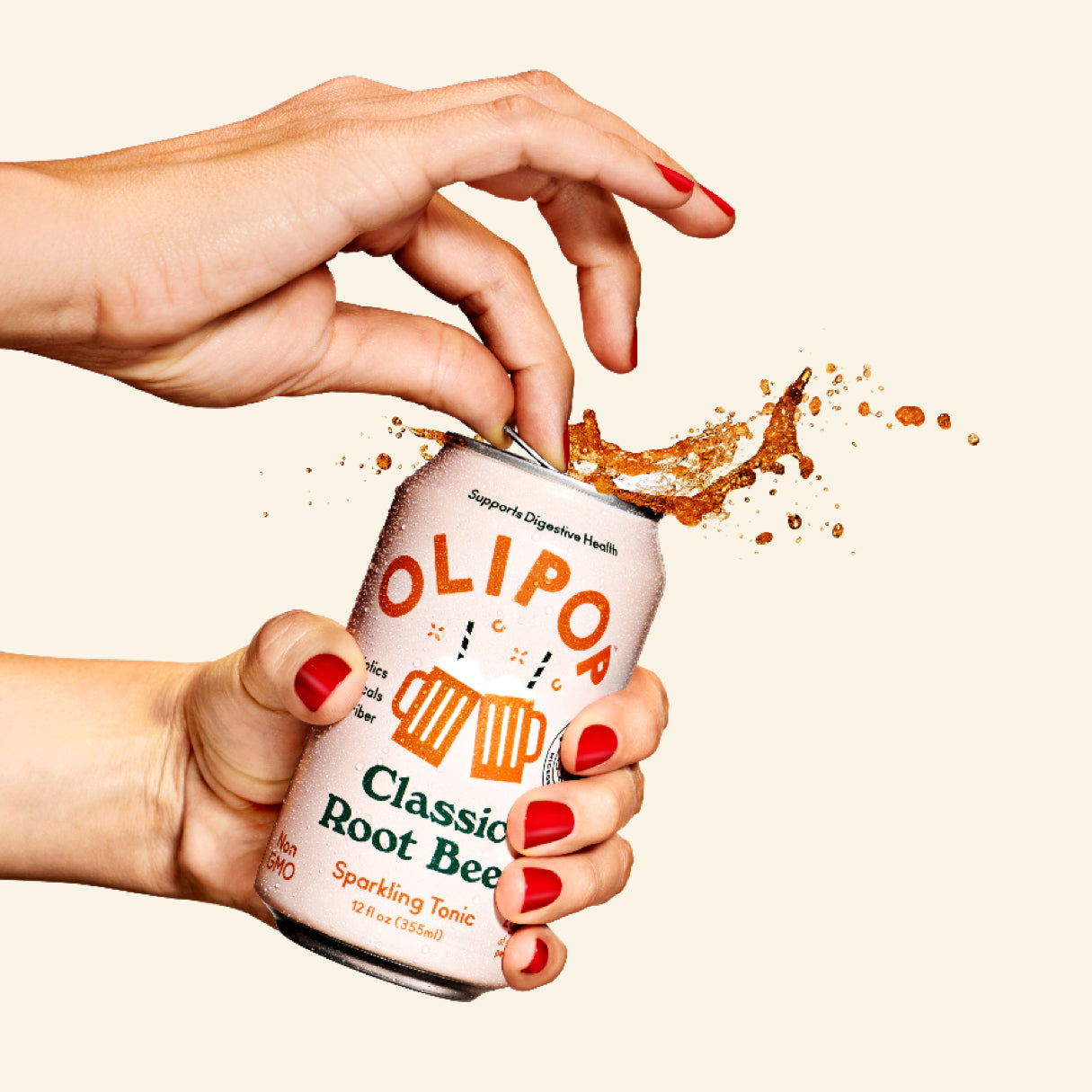 Olipop Root Beer being uncorked by female hands