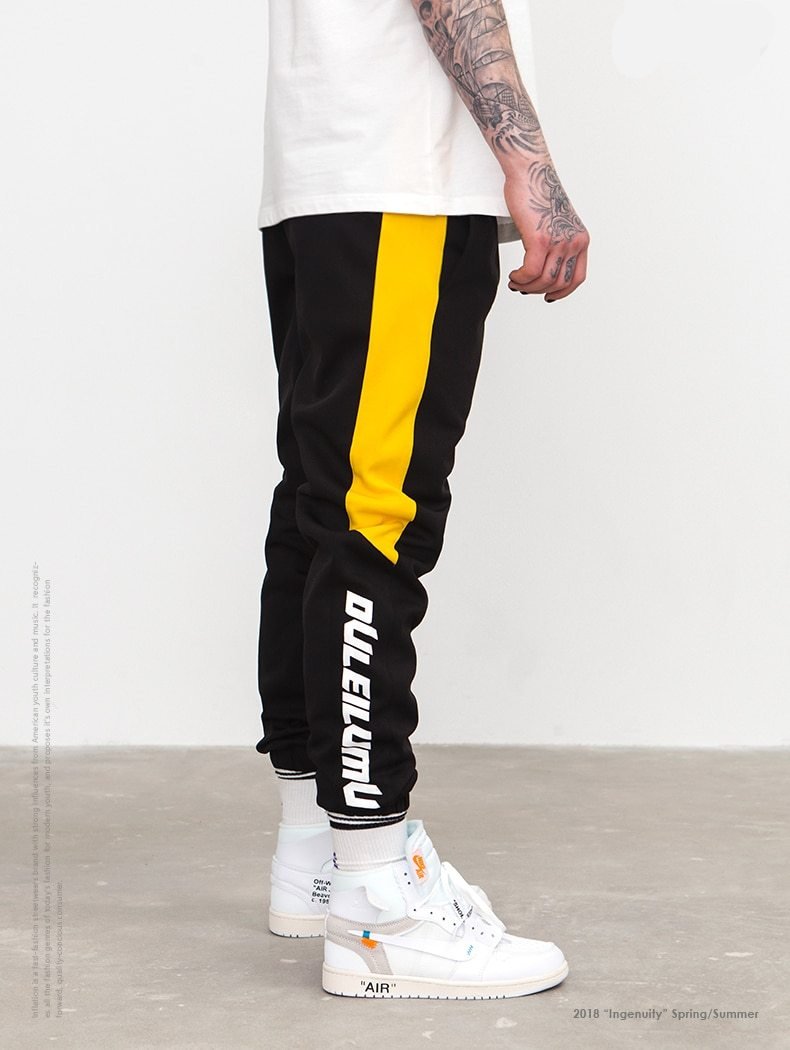 black joggers yellow stripe