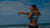 Guardian Athlete standing in front of beach doing yoga