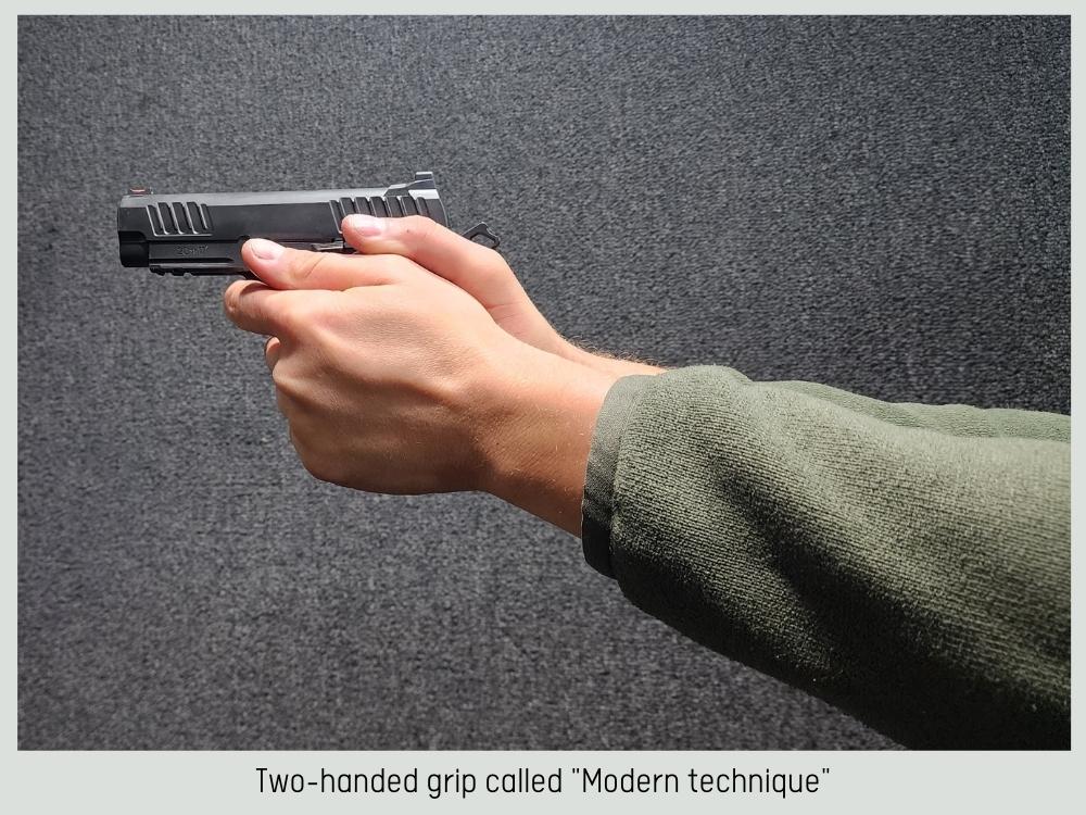 Photo of holding a handgun with a two-handed grip