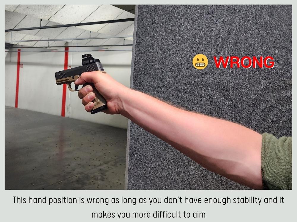 wrong position of holding a gun with one hand 