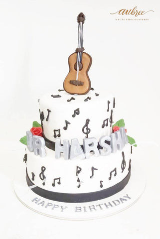 Guitar and treats chocolate drip cake - Cakey Goodness
