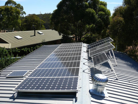 off grid solar panels setup on grey roof