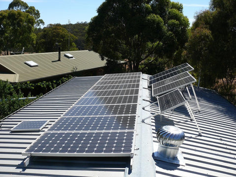 off grid solar panels setup on a grey roof