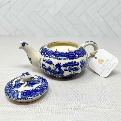 A classic blue and white hand-poured teapot candle