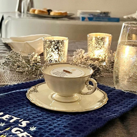 Demitasse/mini teacup candle gift paired with a decorative holiday dish towel.