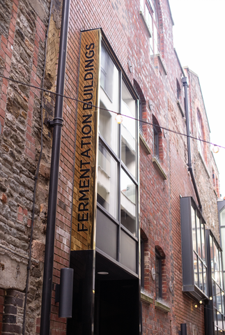 Building exterior with 'Fermentation Buildings' Sign