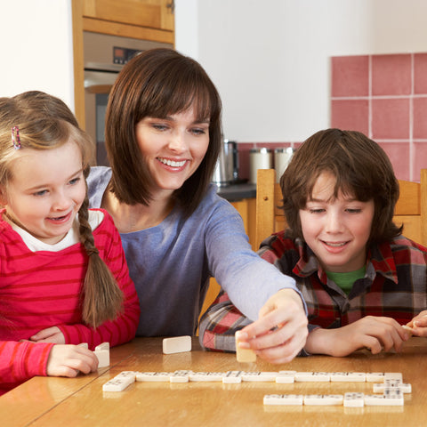 family playing dominoes
