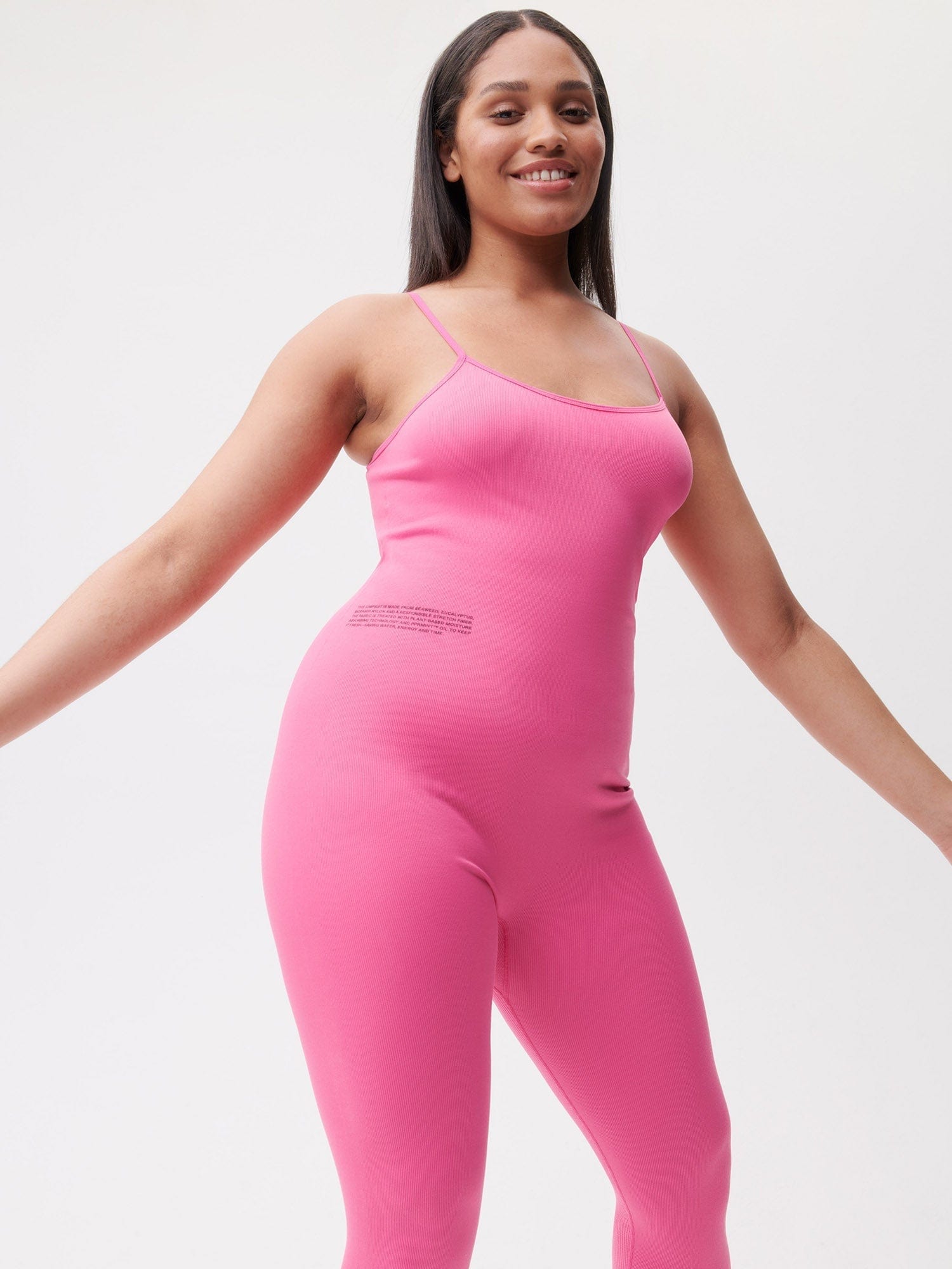 https://cdn.shopify.com/s/files/1/0035/1309/0115/products/Activewear-Womens-Jumpsuit-Flamingo-Pink-4bis.jpg?v=1662475874