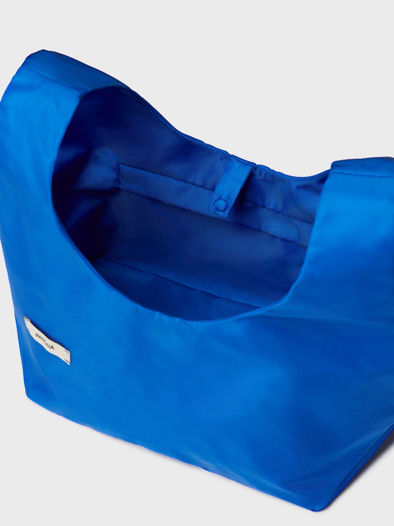 https://cdn.shopify.com/s/files/1/0035/1309/0115/products/Nylon-Mini-Tote-Colbalt-Blue-4.jpg?v=1662475851