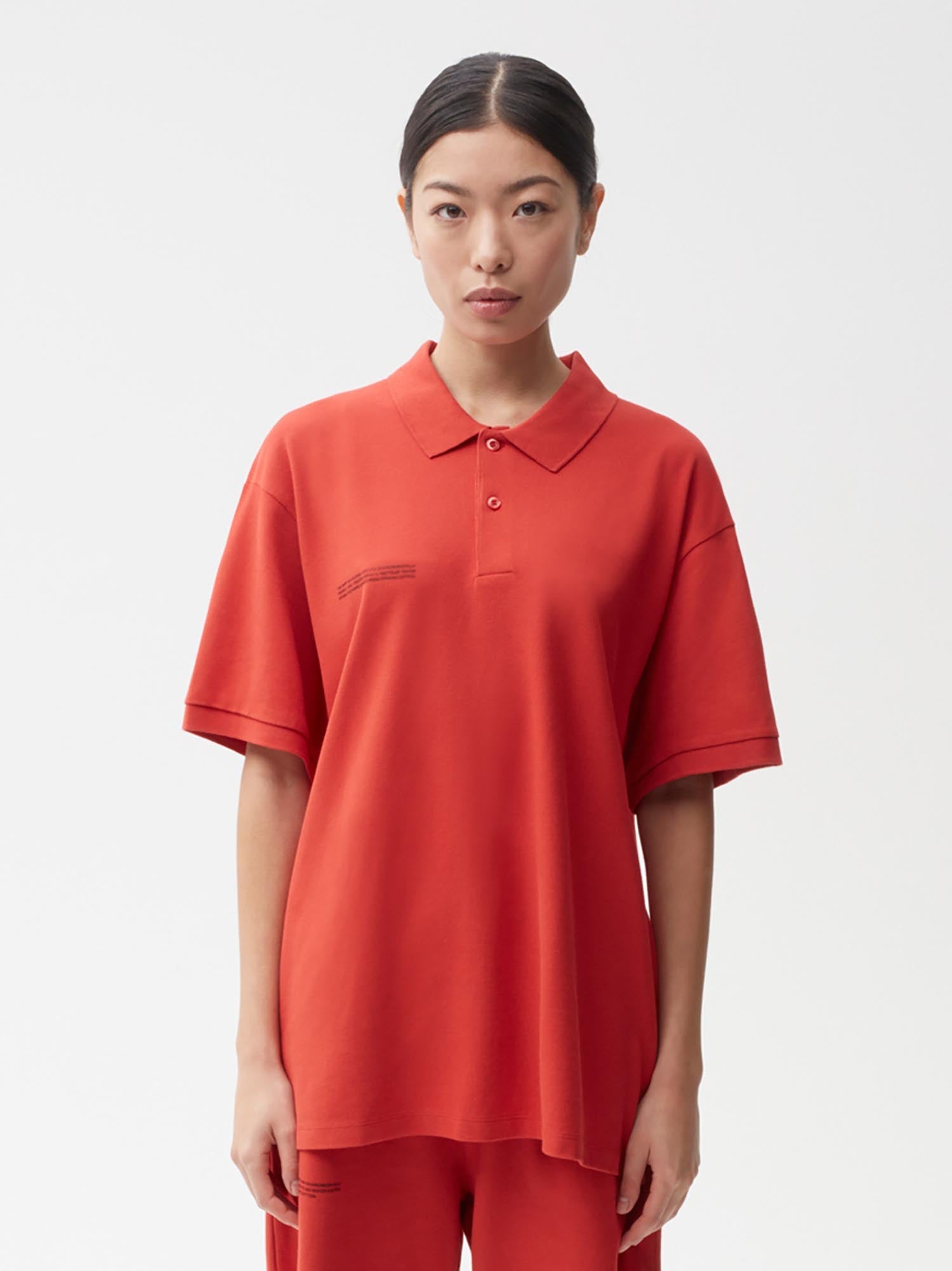 https://cdn.shopify.com/s/files/1/0035/1309/0115/products/Organic-Cotton-Pique-Polo-Scarlet-Red-Female-Model-1_b94f65b6-7ffa-45cf-8e19-0b280a6d6df1.jpg?v=1662475170