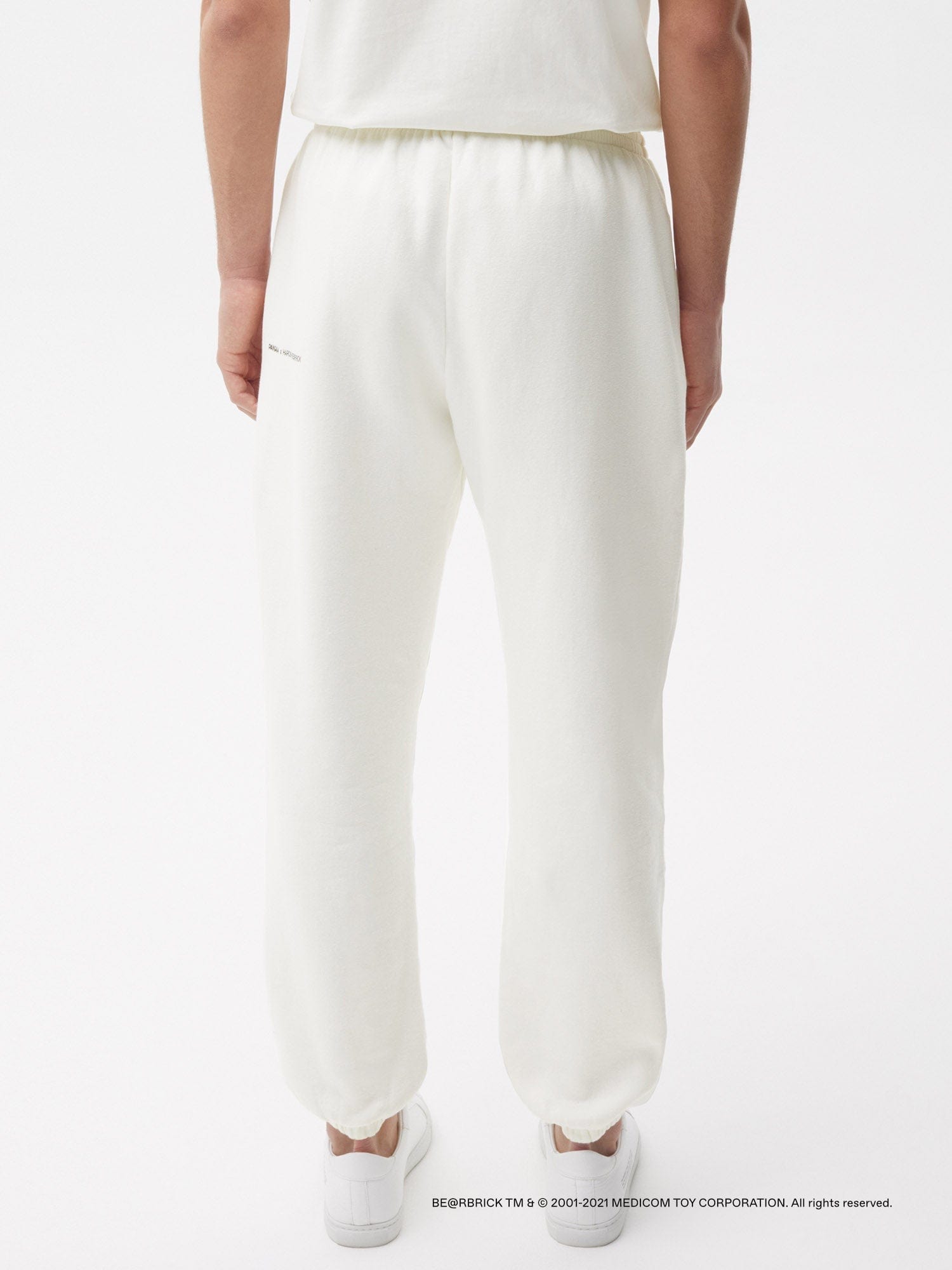 https://cdn.shopify.com/s/files/1/0035/1309/0115/products/Pangaia-Haroshi-Bearbrick-Heavyweight-Organic-Cotton-Track-Pants-Off-White-Male-2_b29b2905-e2eb-4e39-8baa-4d3ab4e73375.jpg?v=1662475466