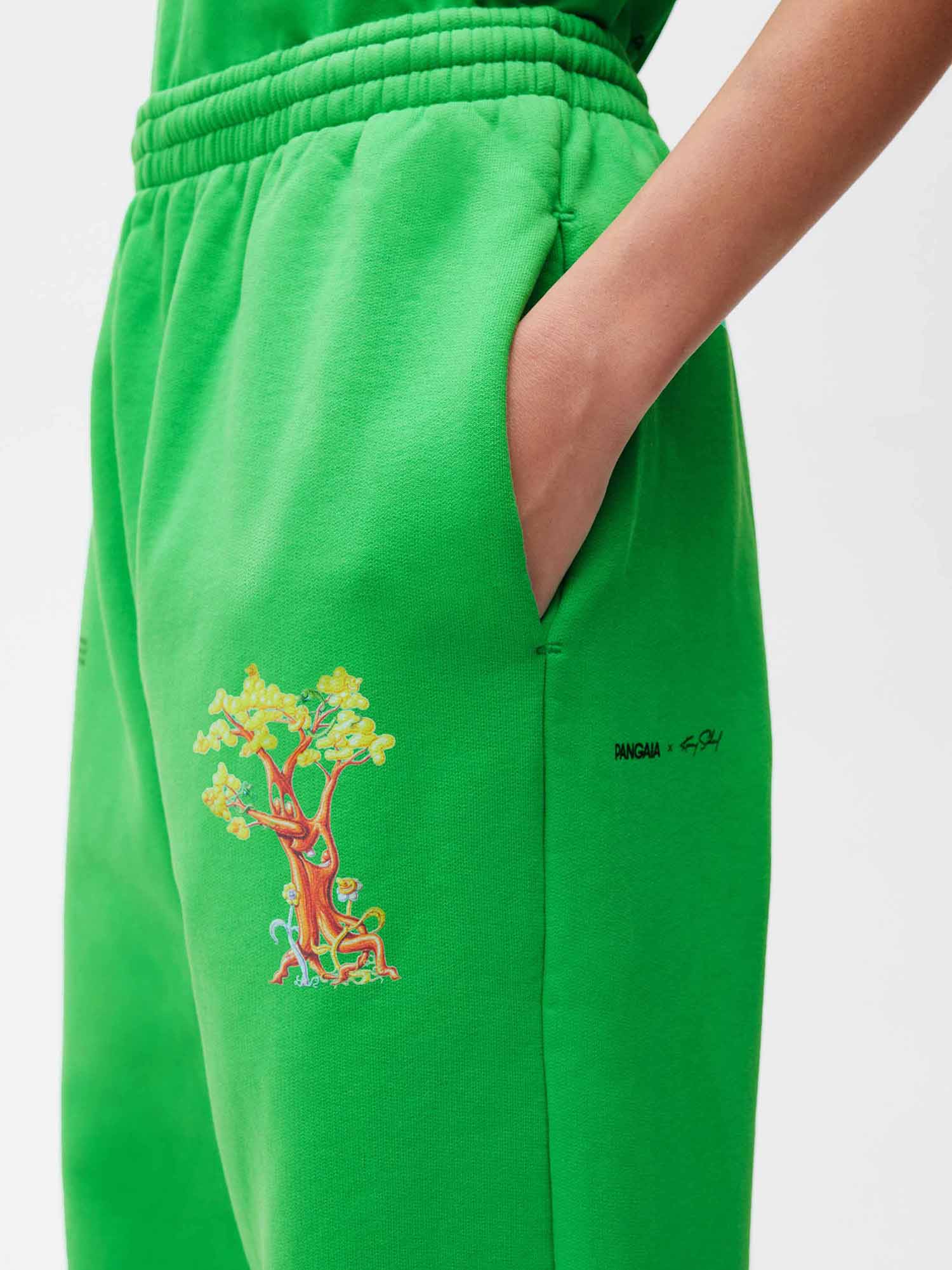 https://cdn.shopify.com/s/files/1/0035/1309/0115/products/Pangaia-Kenny-Scharf-365-Signature-Track-Pants-Paradis-Perdu-Jade-Green-Female-2.jpg?v=1662735686