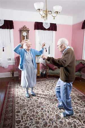 Senior citizens dancing in a rug