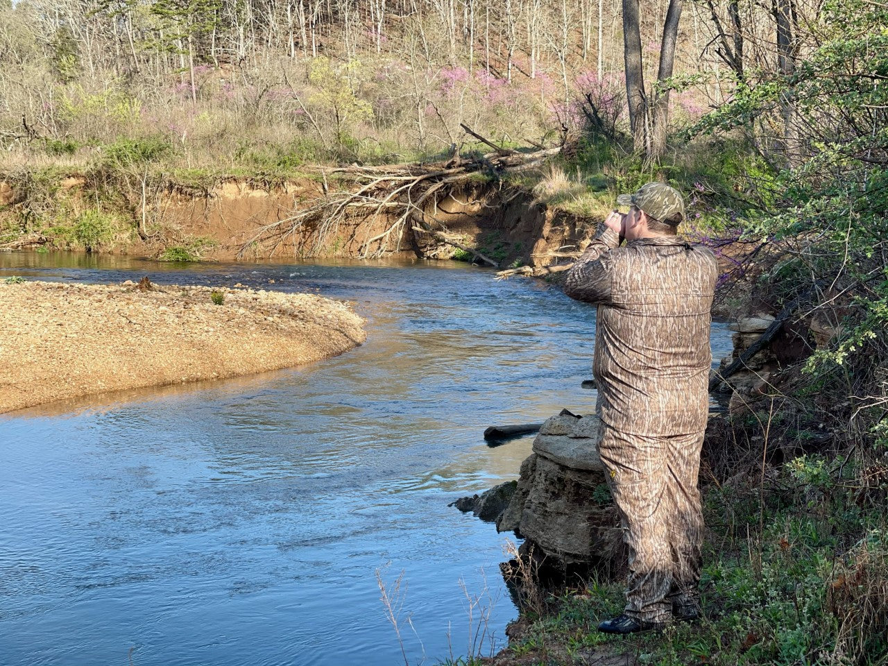 Heath Wood looking for turkey's next to creek.