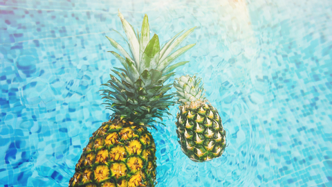 Pineapples in pool water