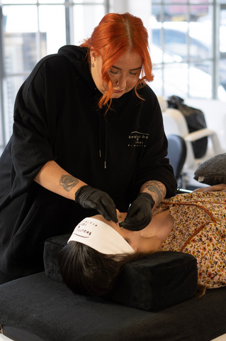 Student performing a Bomb DUO Lash Lift Treatment | Beautiful Brows and Lashes