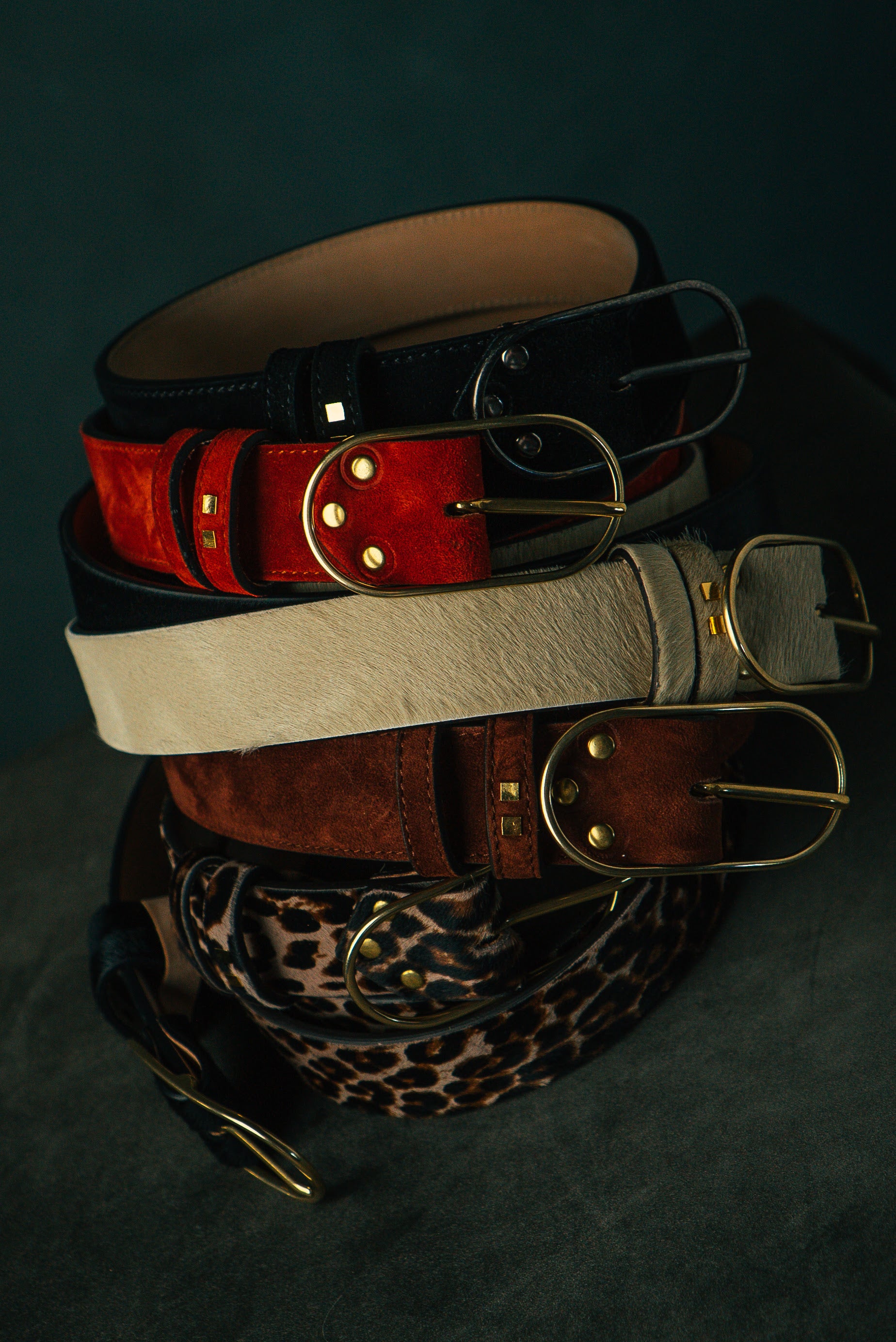 Several Woodmont belts in various materials.